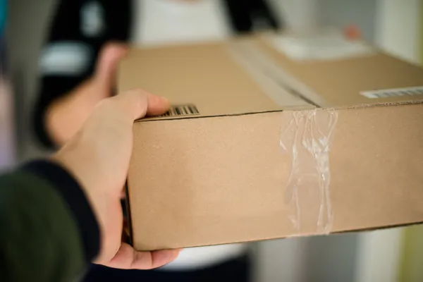 depositphotos_13590093-stock-photo-woman-receiving-parcel